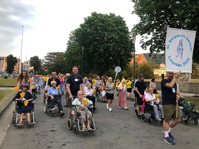 An image of the FASTSIGNS Leeds team at Lourdes 2025 walking.